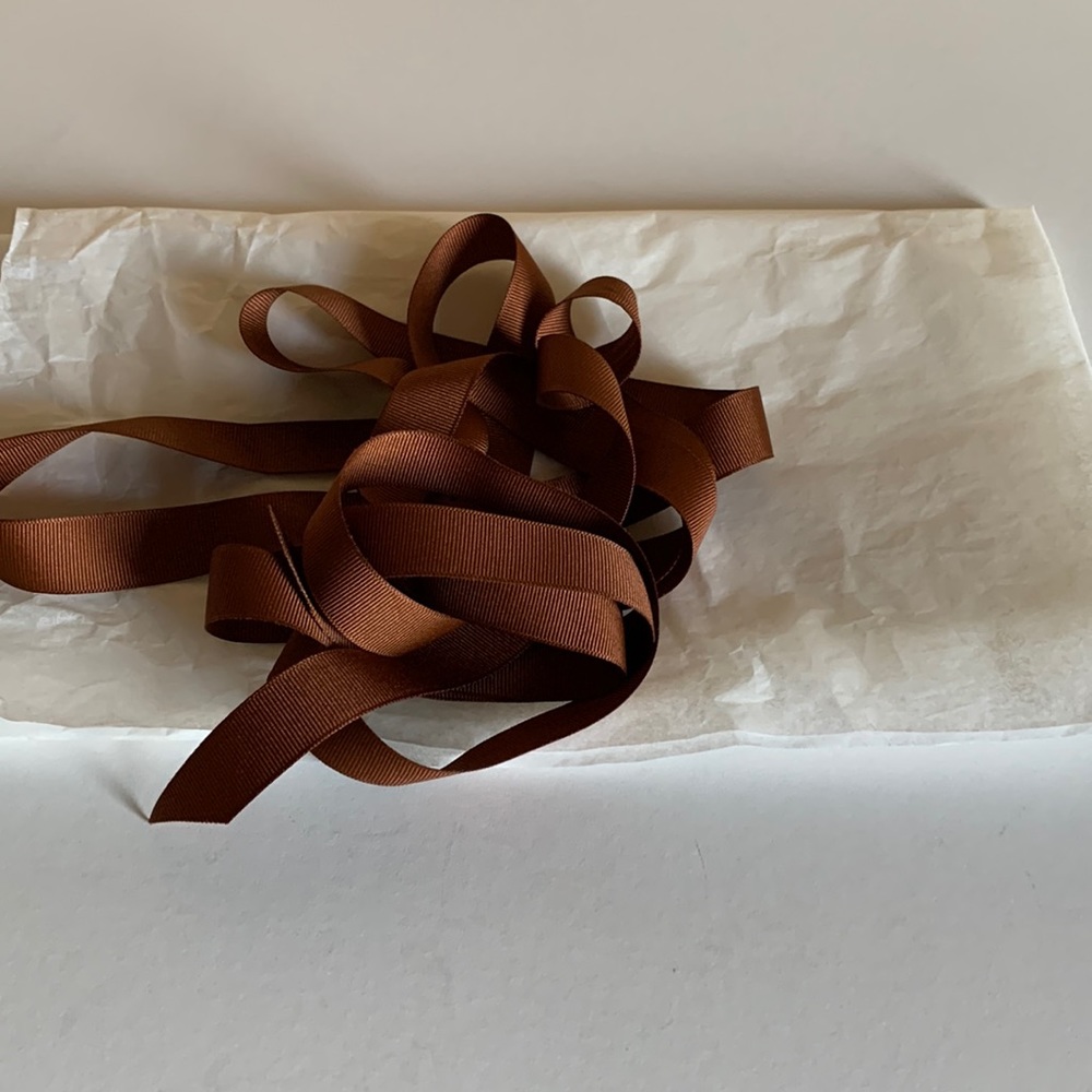 Coach logo tissue and ribbon